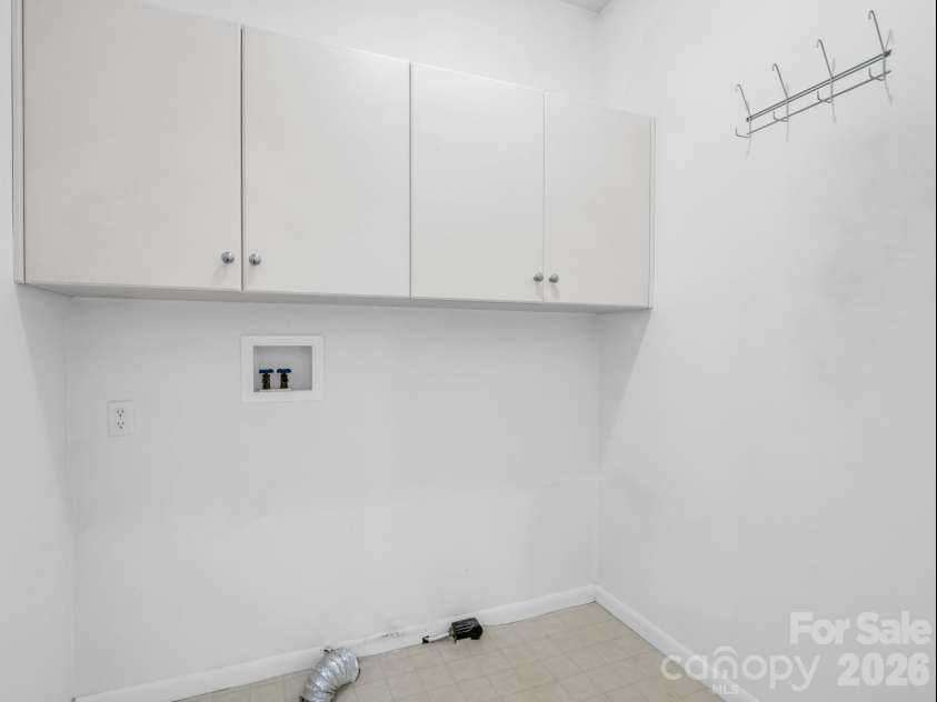 5 Hearthstone Lane, Flat Rock, NC 28731.  MLS# CAR4358961, YatesRealty ID 15969. Laundry with pantry 