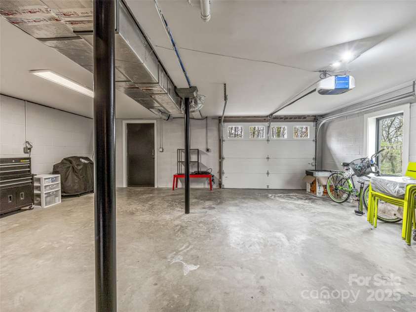 30 Summer Street, Asheville, NC 28804.  MLS# CAR4244619, YatesRealty ID 15976. Garage with EV Charger and Separate Entrance