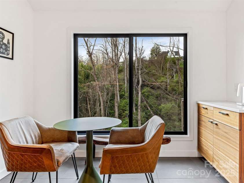 30 Summer Street, Asheville, NC 28804.  MLS# CAR4244619, YatesRealty ID 15976. Sip your coffee or evening wine in intimate style