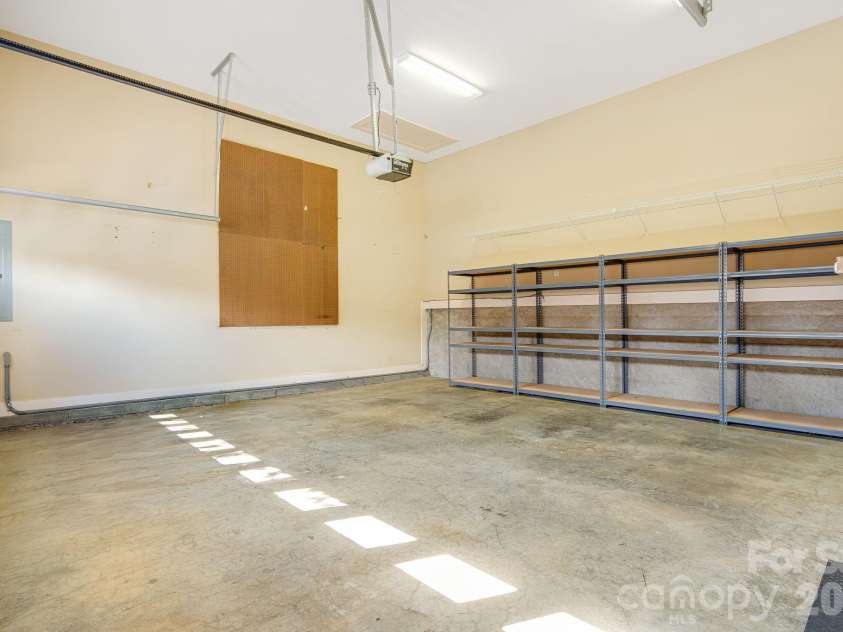 7 Oakhaven Terrace, Asheville, NC 28803.  MLS# CAR4361271, YatesRealty ID 15976. 2 car garage, shelving system conveys