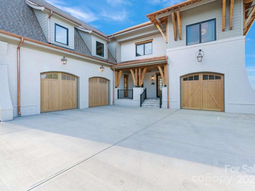 7679 Rabbit Circle, Denver, NC 28037.  MLS# CAR4248734, YatesRealty ID 15997. 3 car garage features cedar doors and epoxy floors.