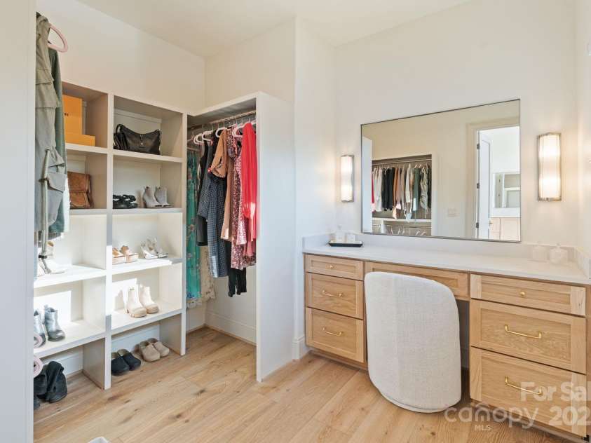 7679 Rabbit Circle, Denver, NC 28037.  MLS# CAR4248734, YatesRealty ID 15997. Expansive closet includes dressing/make-up vanity.  His closet includes a combo washer/dryer