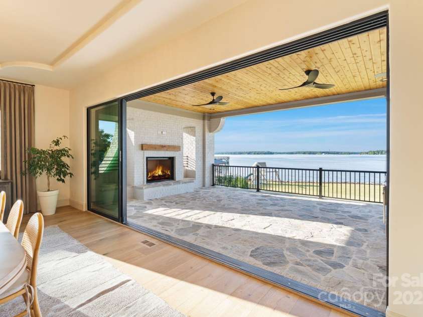 7679 Rabbit Circle, Denver, NC 28037.  MLS# CAR4248734, YatesRealty ID 15997. Large telescoping sliding windows lead to rear porch.