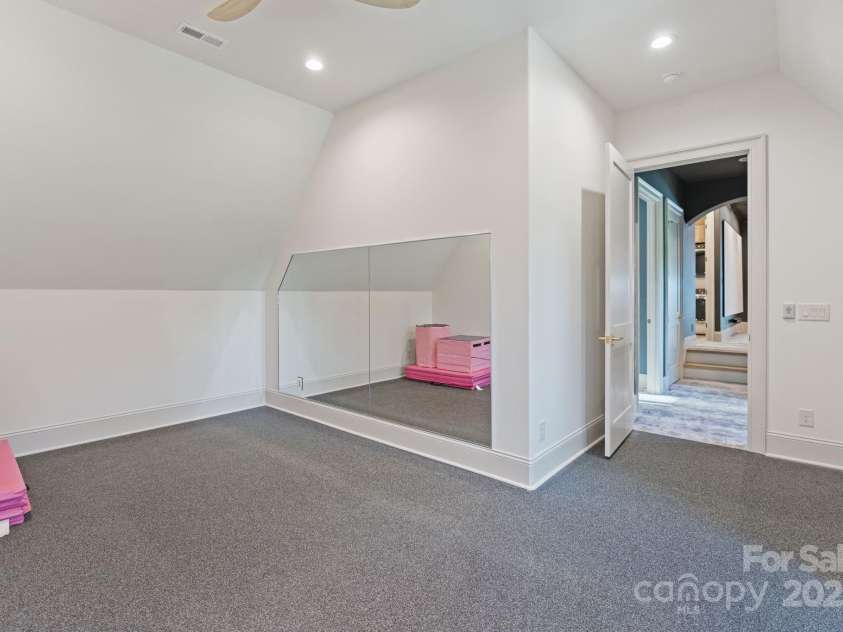 7679 Rabbit Circle, Denver, NC 28037.  MLS# CAR4248734, YatesRealty ID 15997. Spacious fitness room with mirrors and rubber flooring.