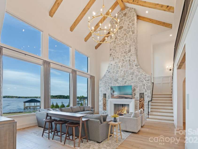 7679 Rabbit Circle, Denver, NC 28037.  MLS# CAR4248734, YatesRealty ID 15997. Two story great room featuring grand stone fireplace with wood stack cutouts and ample room to gather.