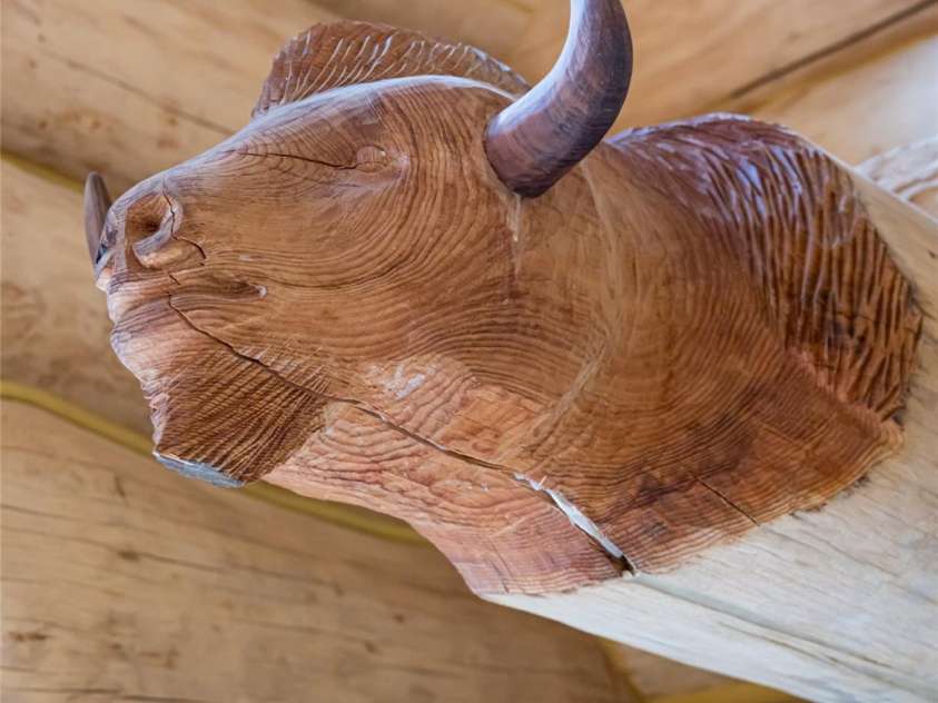 303 Flying Hawk Trail, Waynesville, NC 28786.  MLS# CAR4272138, YatesRealty ID 160. Artist Paul Hornbuckle carved two custom pieces directly into the log onsite during construction!