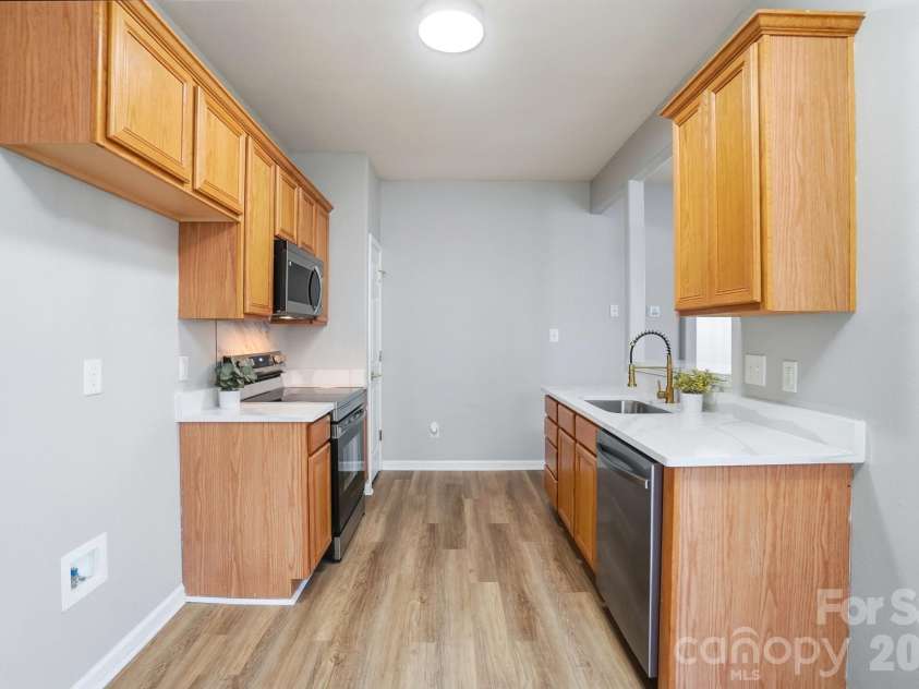 11284 Lions Mane Street, Charlotte, NC 28273.  MLS# CAR4331767, YatesRealty ID 1600. New light fixtures in kitchen