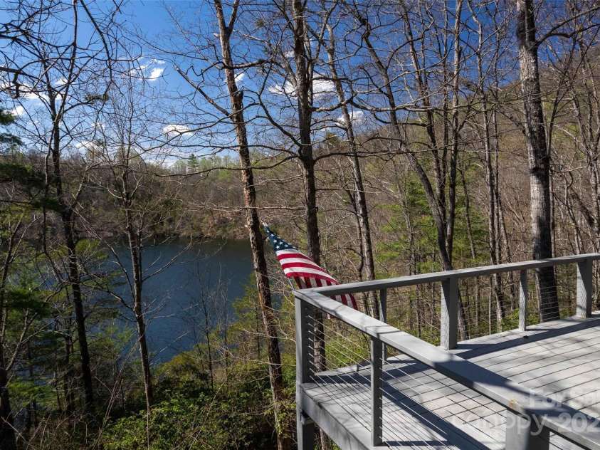 136 Dars Lane, Tuckasegee, NC 28783.  MLS# CAR4248083, YatesRealty ID 1600. Deck and views
