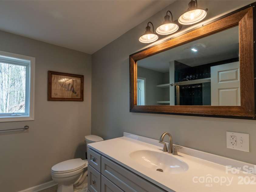 136 Dars Lane, Tuckasegee, NC 28783.  MLS# CAR4248083, YatesRealty ID 1600. Guest Bath