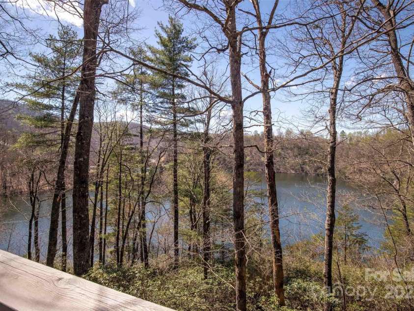 136 Dars Lane, Tuckasegee, NC 28783.  MLS# CAR4248083, YatesRealty ID 1600. Views from deck