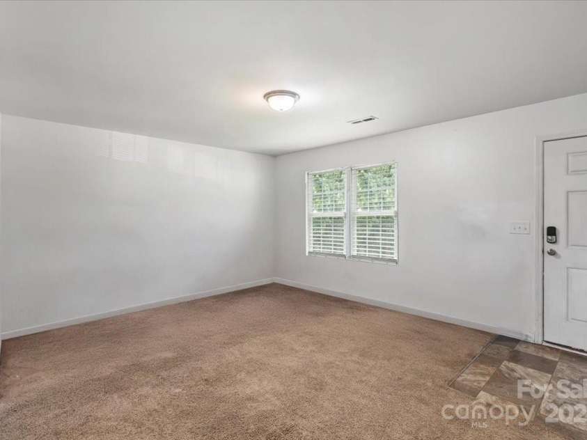 9612 Old Dowd Road, Charlotte, NC 28214.  MLS# CAR4264200, YatesRealty ID 16009. These images are representative or photoshopped to the living room pics