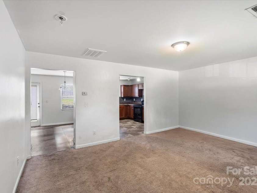9612 Old Dowd Road, Charlotte, NC 28214.  MLS# CAR4264200, YatesRealty ID 16009. These images are representative or photoshopped to the living room pics
