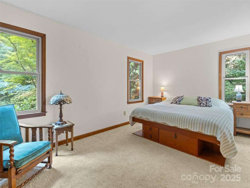 151 Heatherly Heights Road, Saluda, NC 28773.  MLS# CAR4257112, YatesRealty ID 16014. Primary bedroom with adjacent bathroom