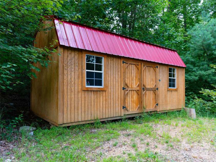 151 Heatherly Heights Road, Saluda, NC 28773.  MLS# CAR4257112, YatesRealty ID 16014. Storage building with power and shelving