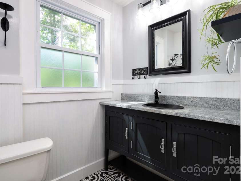 135 Tacoma Circle, Asheville, NC 28801.  MLS# CAR4259347, YatesRealty ID 16015. Antique-Style Vanity with Granite Counter