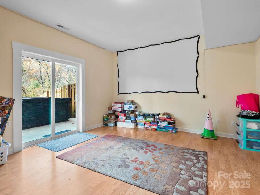 39 Sunnie Rae Lane, Candler, NC 28715.  MLS# CAR4211201, YatesRealty ID 1602. Den area in lower level Basement area