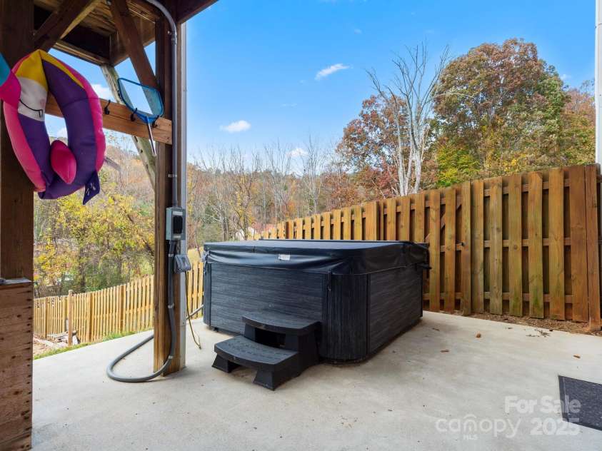 39 Sunnie Rae Lane, Candler, NC 28715.  MLS# CAR4211201, YatesRealty ID 1602. Private area with hot tub
