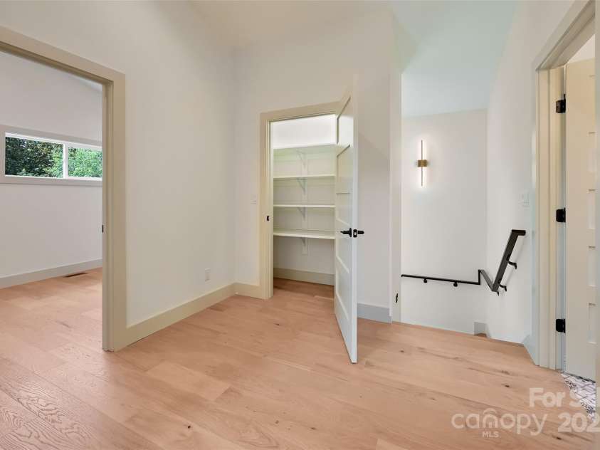 30 Sand Hill Road, Asheville, NC 28806.  MLS# CAR4265275, YatesRealty ID 16020. Upstairs to 2 bedrooms, flex space, guest bath and storage