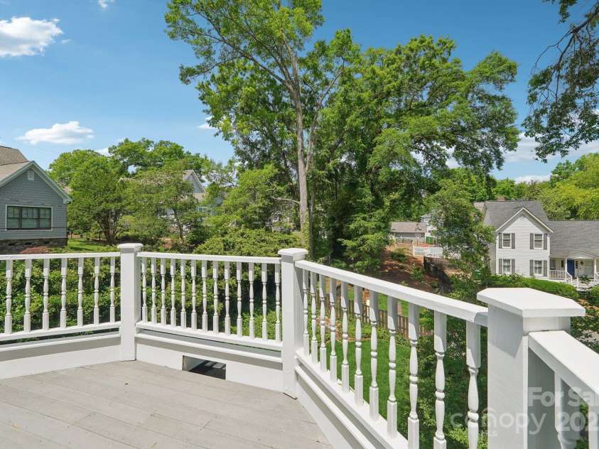 545 Dilworth Mews Court, Charlotte, NC 28203.  MLS# CAR4237335, YatesRealty ID 16023. A slice of Center City & South End skyline through the trees.  Image when the leaves fall!