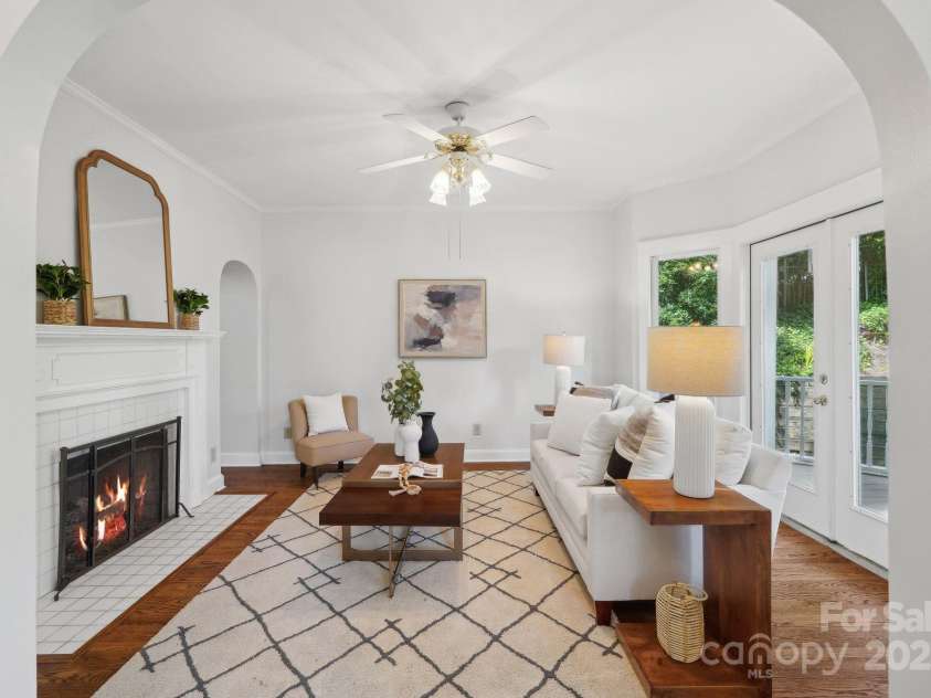 545 Dilworth Mews Court, Charlotte, NC 28203.  MLS# CAR4237335, YatesRealty ID 16023. Living Room with gas fireplace (fireplace not used - sold as is - no known issues - virtually staged fire)