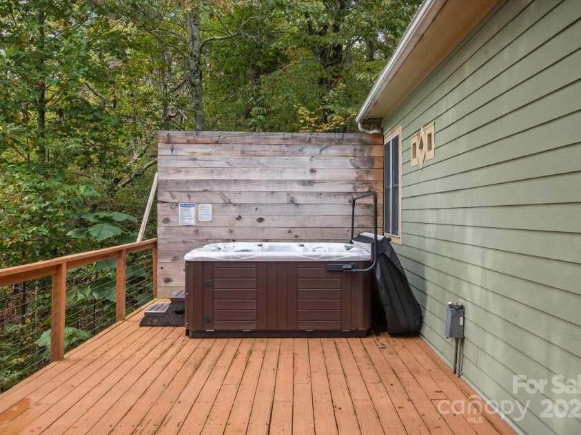 94 Davey Crockett Road, Fairview, NC 28730.  MLS# CAR4310188, YatesRealty ID 1603. Hot Tub for Cozy Evenings