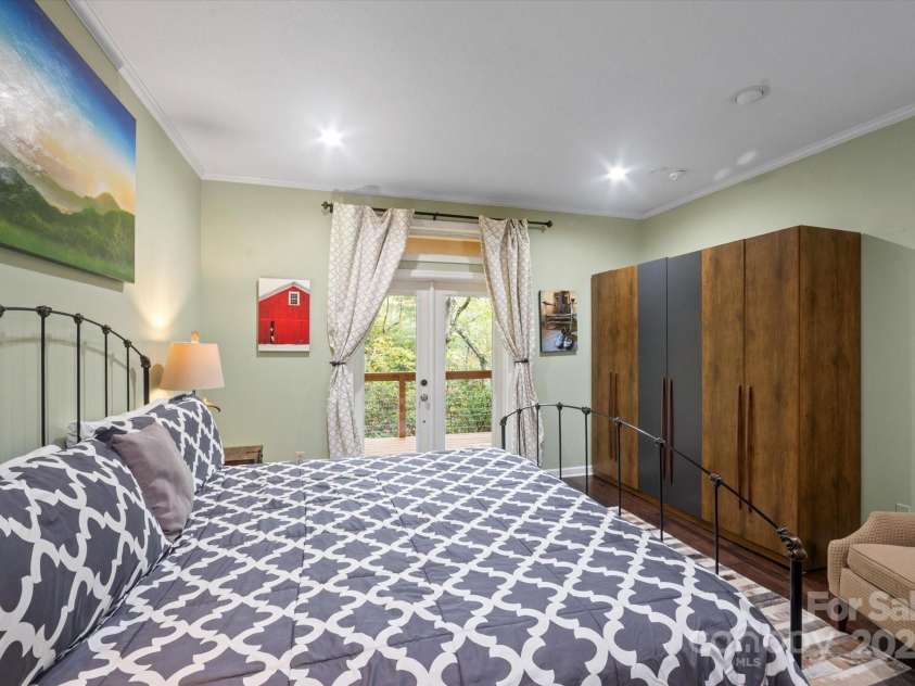 94 Davey Crockett Road, Fairview, NC 28730.  MLS# CAR4310188, YatesRealty ID 1603. Primary Bedroom