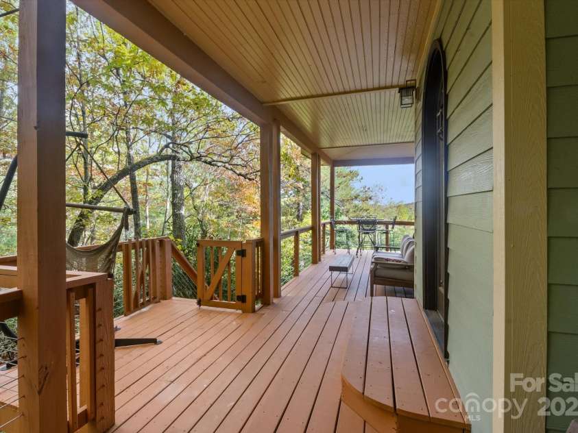 94 Davey Crockett Road, Fairview, NC 28730.  MLS# CAR4310188, YatesRealty ID 1603. Wraparound Deck - Front Door