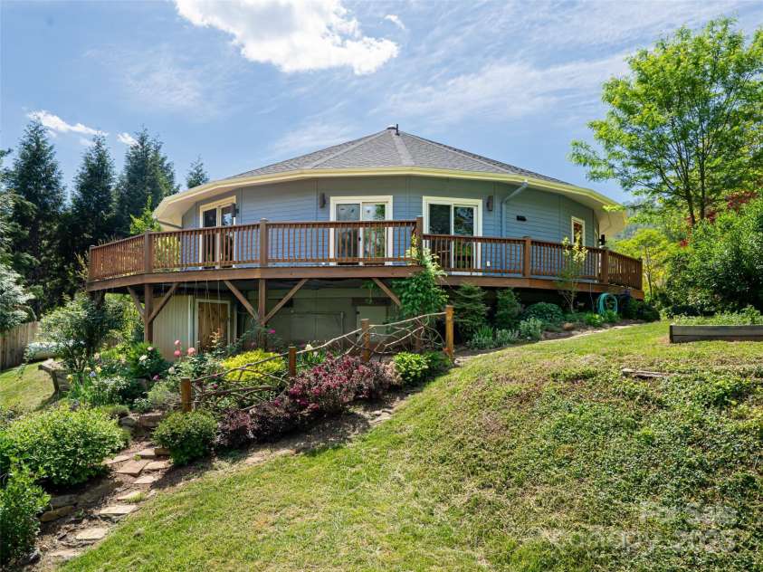 15 Sassy Lane, Asheville, NC 28805.  MLS# CAR4248835, YatesRealty ID 16032. DELTEC circular home; 3 Bedroom, 2 full bath, approximately 2,150  sq. ft., domed roof with skylight, wrap-around wooden deck, lush gardens on 1 acre. Long range mountain views