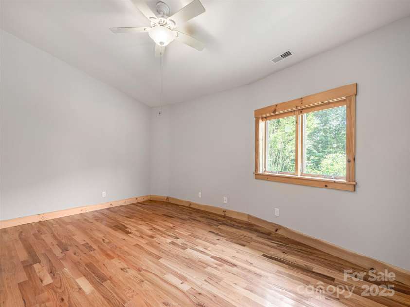 15 Sassy Lane, Asheville, NC 28805.  MLS# CAR4248835, YatesRealty ID 16032. Guest bedroom suite. Light and bright with hardwood floors