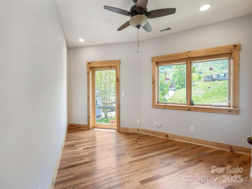 15 Sassy Lane, Asheville, NC 28805.  MLS# CAR4248835, YatesRealty ID 16032. Third bedroom.  Works well as an office, nursery, playroom or library.  Natural light fills the room