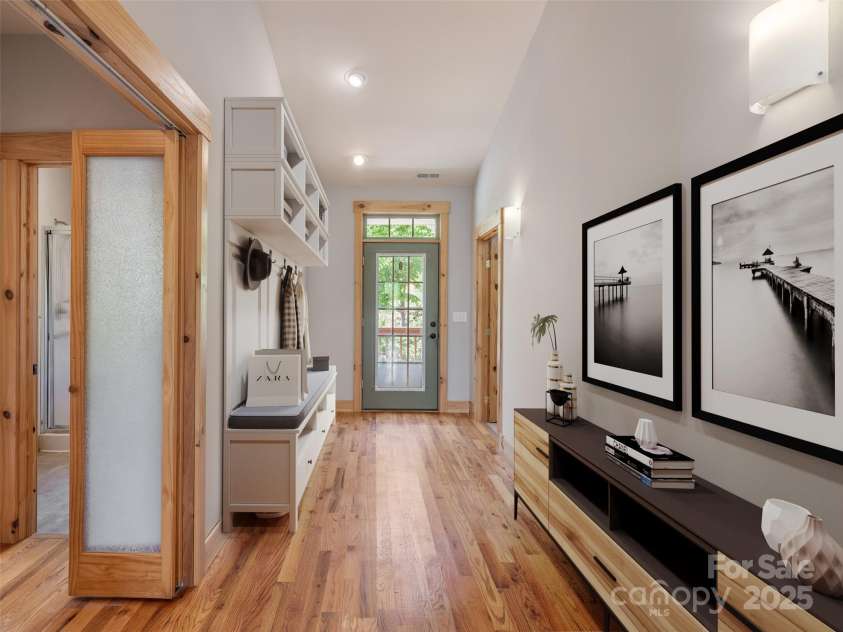 15 Sassy Lane, Asheville, NC 28805.  MLS# CAR4248835, YatesRealty ID 16032. Virtually staged front door entryway leads to sitting/reading area and Great Room. Flooded with natural light