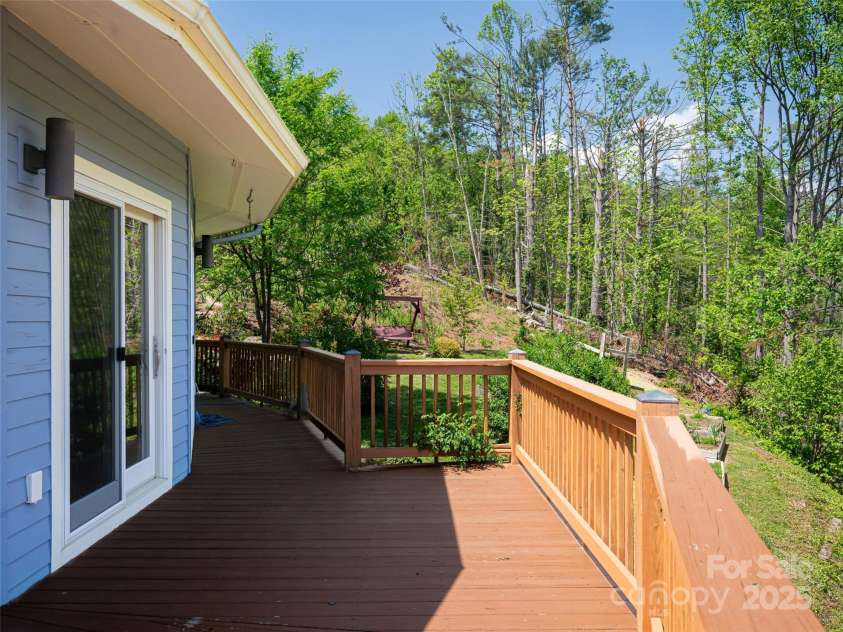 15 Sassy Lane, Asheville, NC 28805.  MLS# CAR4248835, YatesRealty ID 16032. Wrap around deck overlooking the gardens