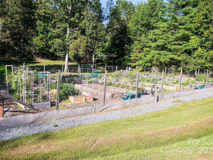 1005 Utsonati Lane, Brevard, NC 28712.  MLS# CAR4246828, YatesRealty ID 16033. Community Garden