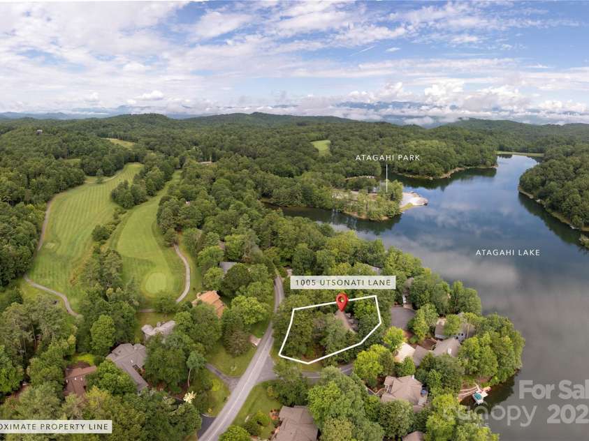 1005 Utsonati Lane, Brevard, NC 28712.  MLS# CAR4246828, YatesRealty ID 16033. Walk to the Lake Atagahi