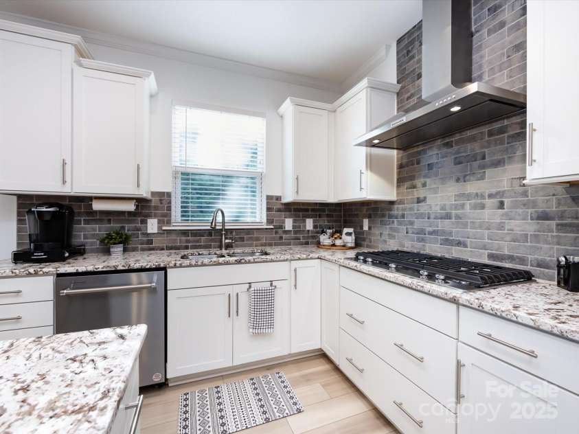 8903 Ansley Park Place, Huntersville, NC 28078.  MLS# CAR4311393, YatesRealty ID 16036. Beautiful Gourmet Kitchen with all the upgrades including granite counters, stainless steel appliances including Refrigerator to remain, wall oven, gas cook top, hood system, island with seating/storage, custom l