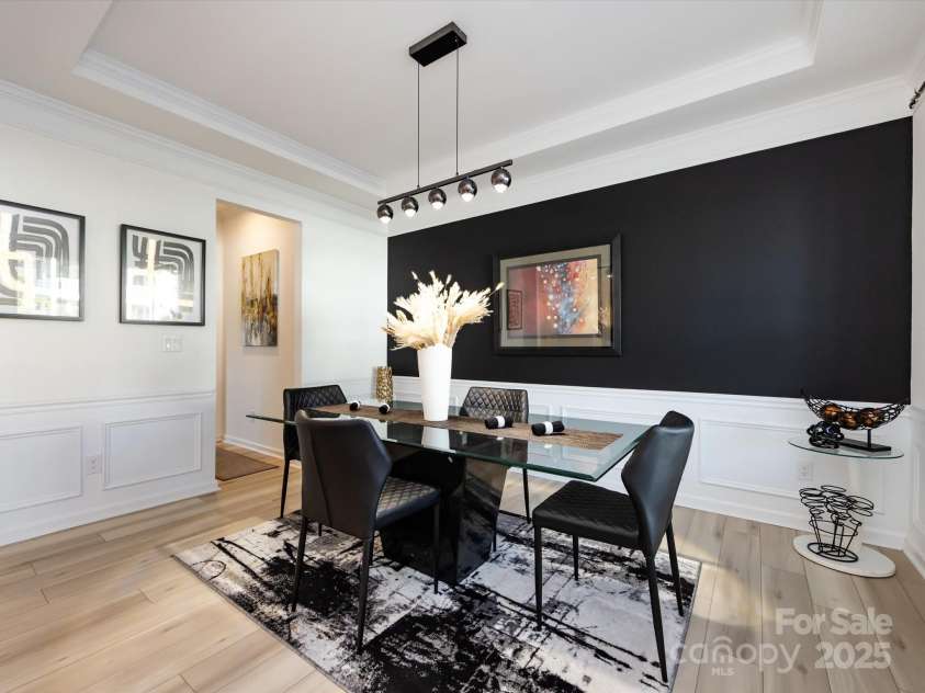 8903 Ansley Park Place, Huntersville, NC 28078.  MLS# CAR4311393, YatesRealty ID 16036. Formal Dining Room features tray ceiling with crown molding & wainscoting!