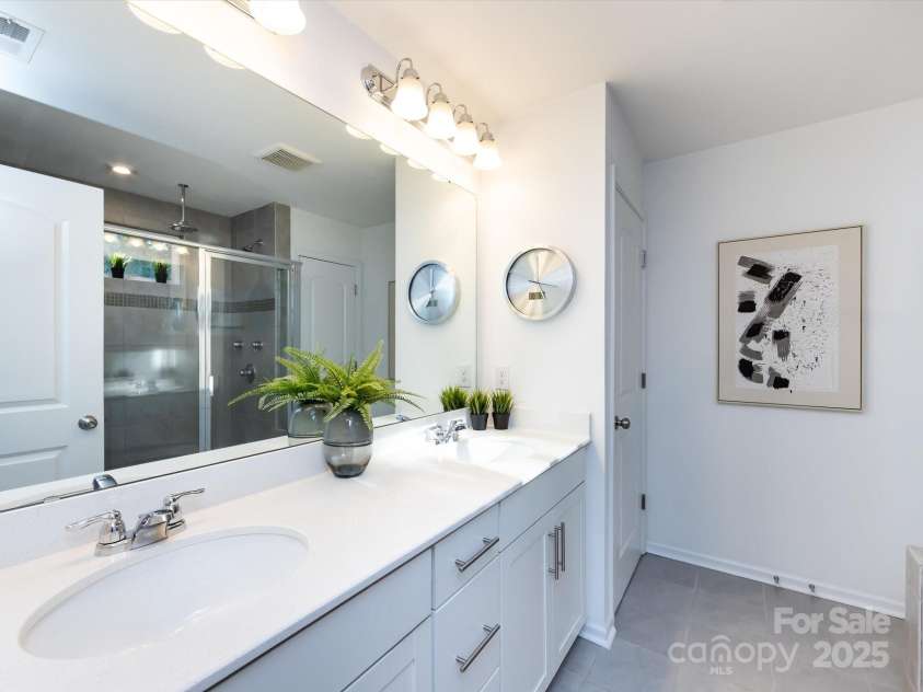 8903 Ansley Park Place, Huntersville, NC 28078.  MLS# CAR4311393, YatesRealty ID 16036. Primary Bath offers dual vanity, tiled shower & tile flooring!