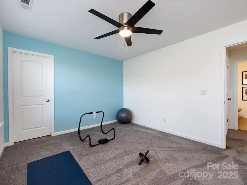 8903 Ansley Park Place, Huntersville, NC 28078.  MLS# CAR4311393, YatesRealty ID 16036. Spacious Bedroom 4 on upper level with ceiling fan/light!