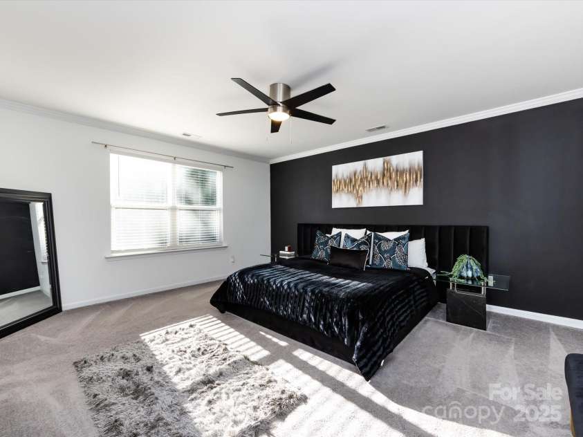 8903 Ansley Park Place, Huntersville, NC 28078.  MLS# CAR4311393, YatesRealty ID 16036. Spacious Primary Suite on upper level with crown molding, ceiling fan, private bath & walk in closet!