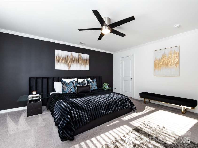 8903 Ansley Park Place, Huntersville, NC 28078.  MLS# CAR4311393, YatesRealty ID 16036. Spacious Primary Suite on upper level with crown molding, ceiling fan, private bath & walk in closet!