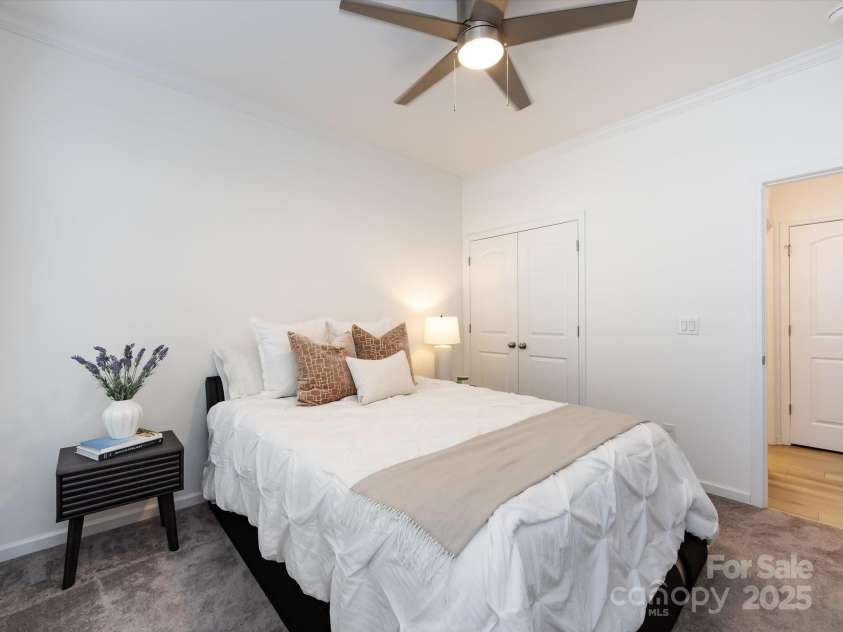 8903 Ansley Park Place, Huntersville, NC 28078.  MLS# CAR4311393, YatesRealty ID 16036. Vaulted Guest suite on main level with crown molding & ceiling fan!