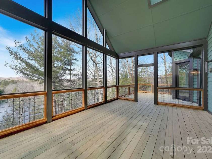 5039 Connestee Trail, Brevard, NC 28712.  MLS# CAR4216573, YatesRealty ID 1604. Covered Screen Room