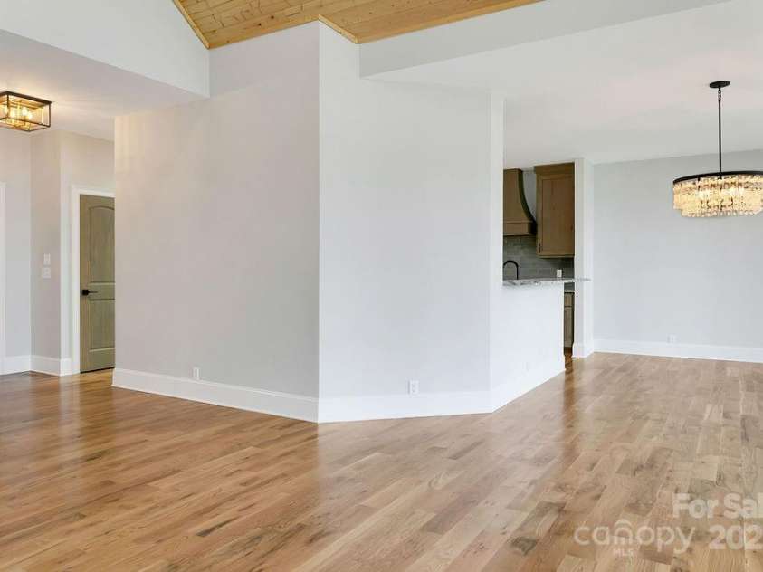 5039 Connestee Trail, Brevard, NC 28712.  MLS# CAR4216573, YatesRealty ID 1604. Kitchen to Dinning