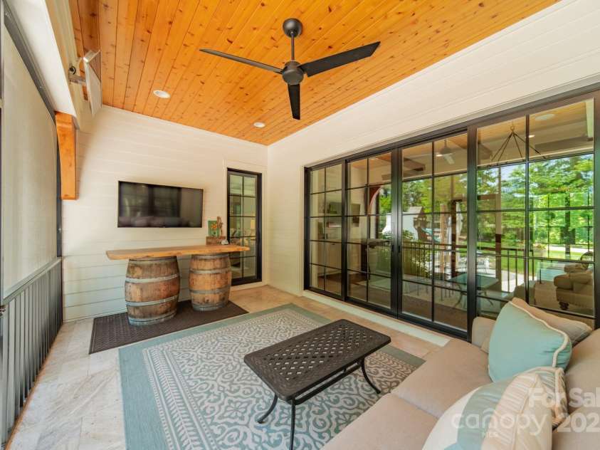 14228 Ryker Way, Davidson, NC 28036.  MLS# CAR4319295, YatesRealty ID 16043. Screened porch