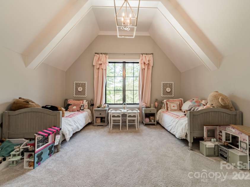 14228 Ryker Way, Davidson, NC 28036.  MLS# CAR4319295, YatesRealty ID 16043. Upper level bedroom three with vaulted ceilings.