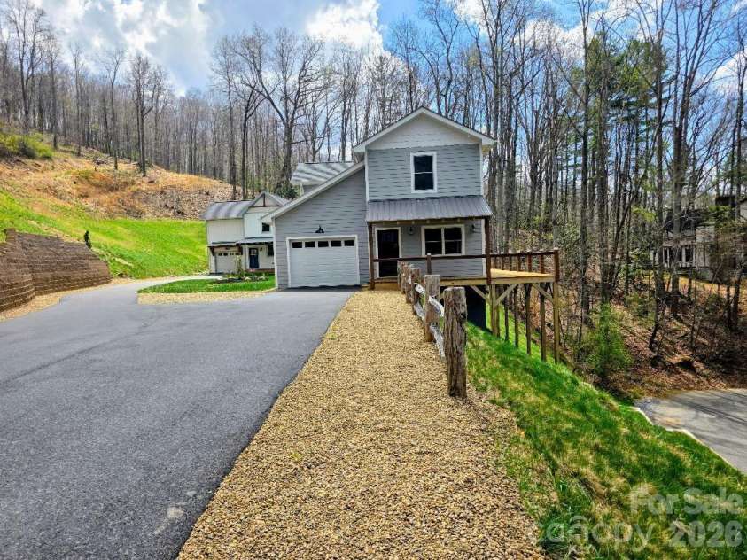 22 Salt Box Haven, Burnsville, NC 28714.  MLS# CAR4364362, YatesRealty ID 16043. 22 Saltbox Haven with driveway and parking visible