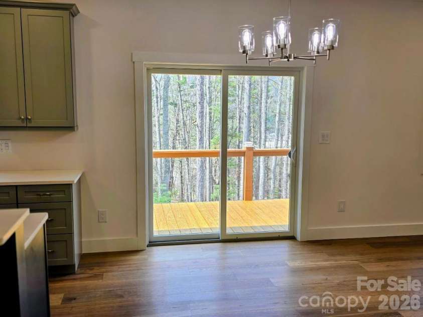 22 Salt Box Haven, Burnsville, NC 28714.  MLS# CAR4364362, YatesRealty ID 16043. Dining area with door to deck