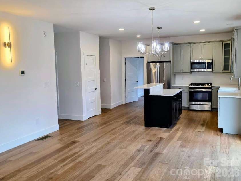 22 Salt Box Haven, Burnsville, NC 28714.  MLS# CAR4364362, YatesRealty ID 16043. Kitchen with unique lighting, island and GE appliances