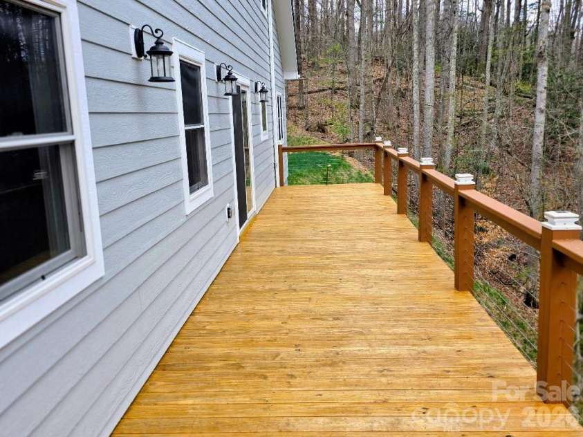 22 Salt Box Haven, Burnsville, NC 28714.  MLS# CAR4364362, YatesRealty ID 16043. View of deck; notice the solar powered lighting on the railing posts