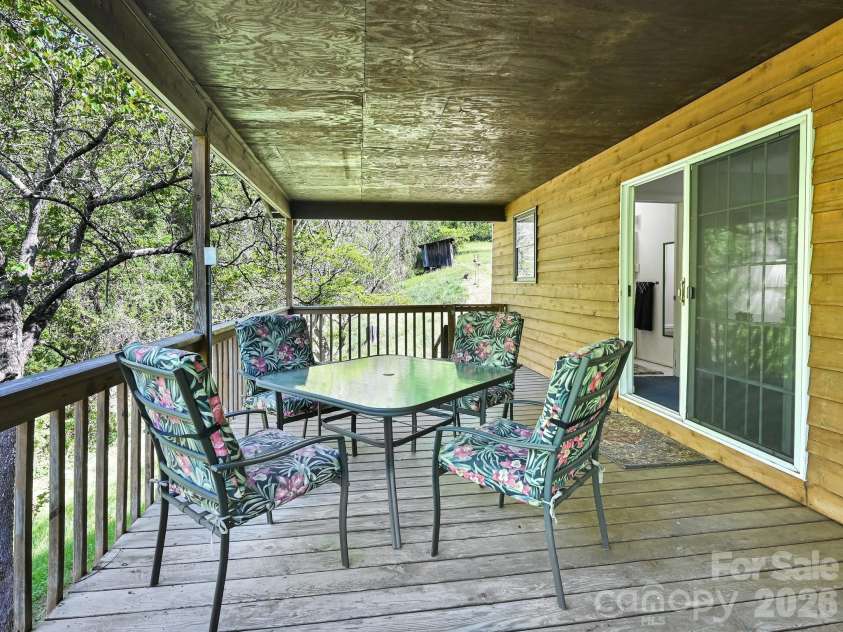 623 School Road, Asheville, NC 28803.  MLS# CAR4365936, YatesRealty ID 16044. Side Deck towards back yard